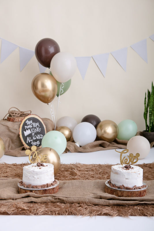 One-year-old baby enjoying his first birthday Cake Smash Nelspruit session with a neutral earth-tone setup