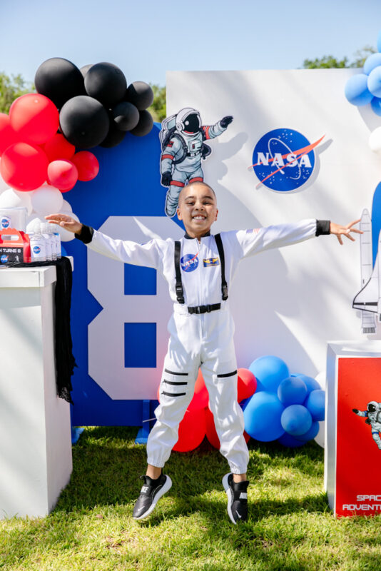 Kids enjoying NASA themed birthday party outdoors