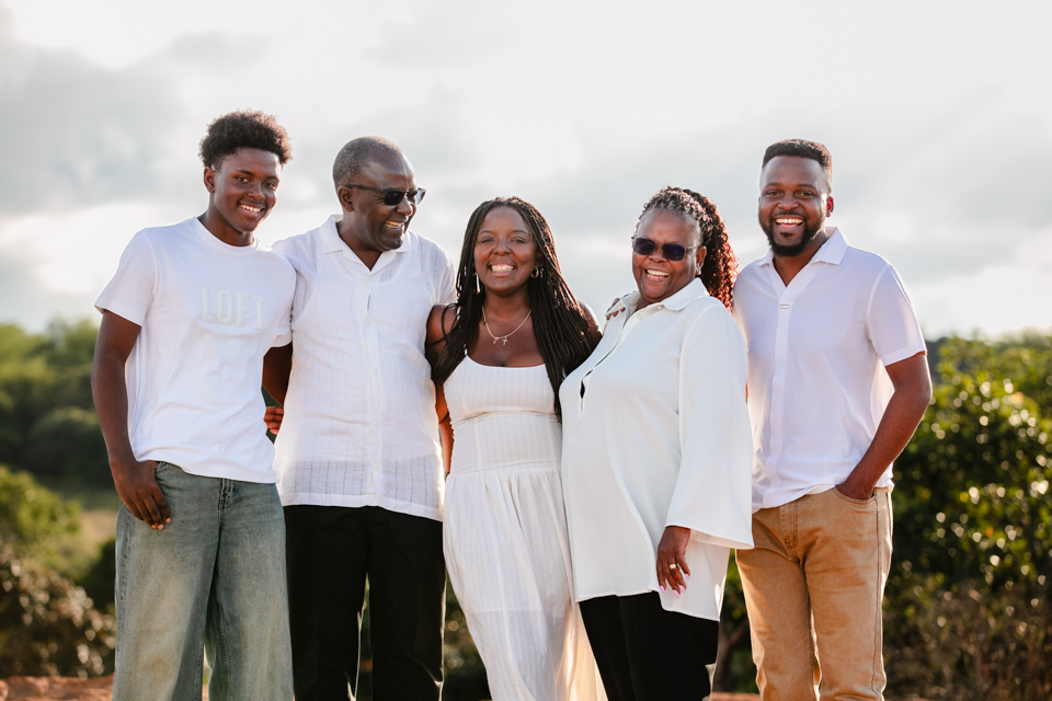 Large family group photo in golden hour light at Shandon Estate