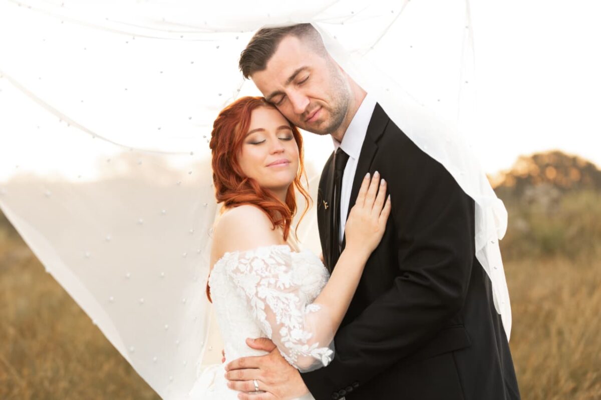 Couples portrait of beautiful make up on bride and handsome groom in Nelspruit