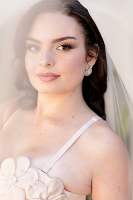 Wedding makeup artist's bridal transformation featuring flawless complexion and timeless glamour.